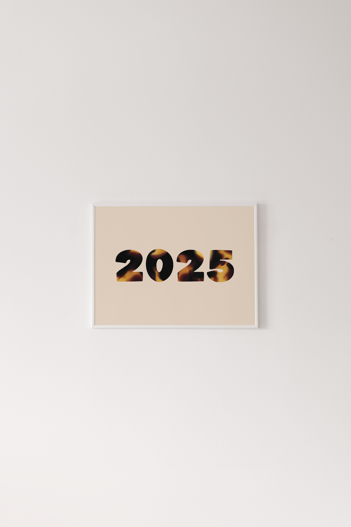 Beige card with '2025' printed on it against a light gray background