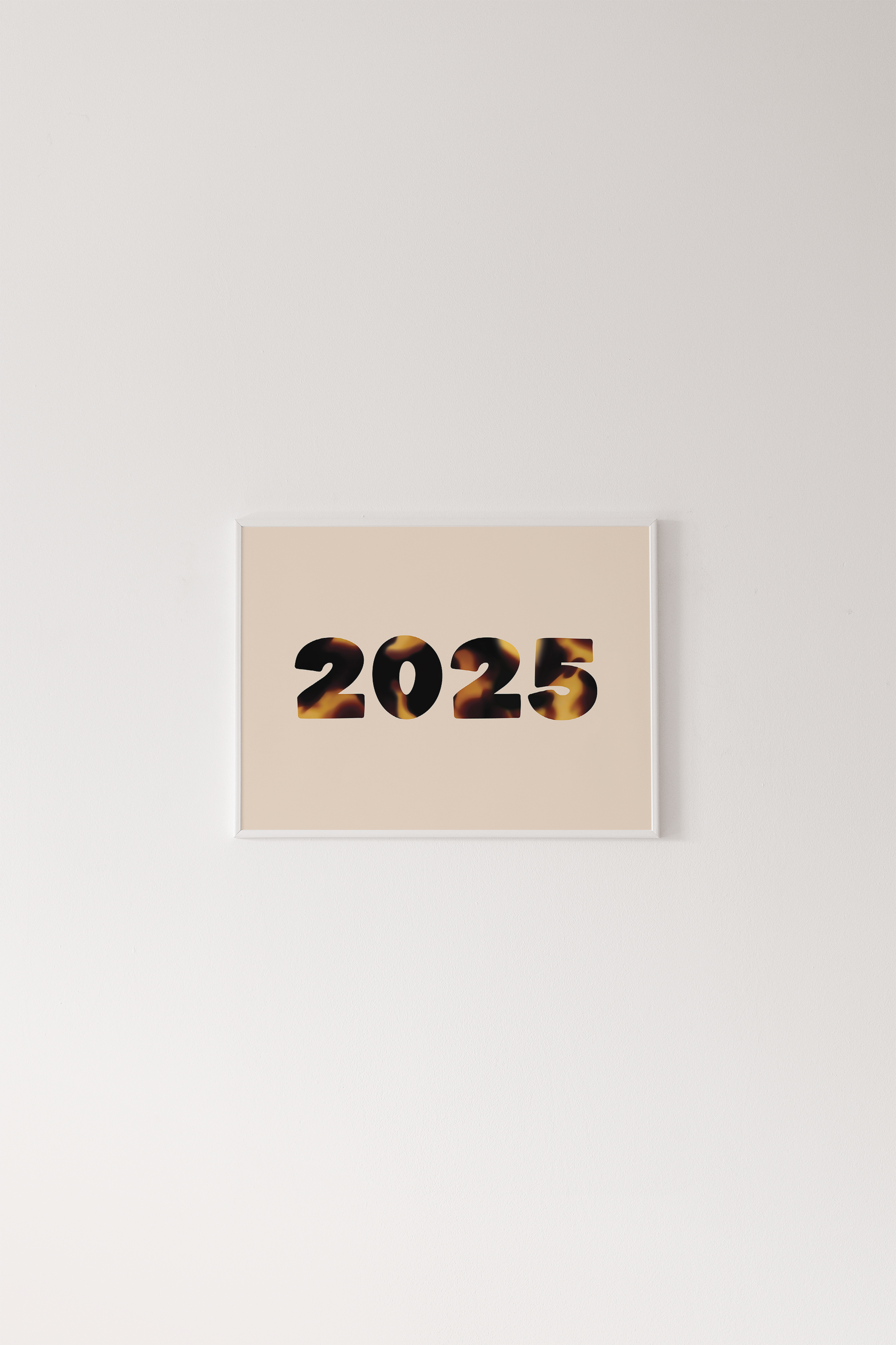 Beige card with '2025' printed on it against a light gray background