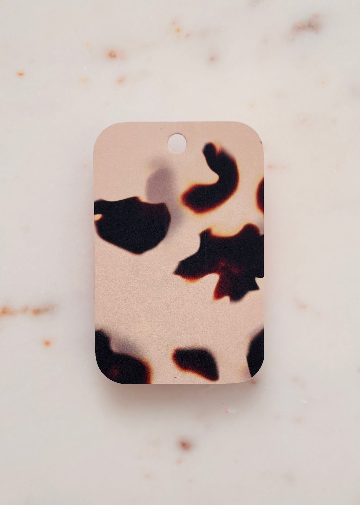 Light Tortoiseshell gift tag on a marble background